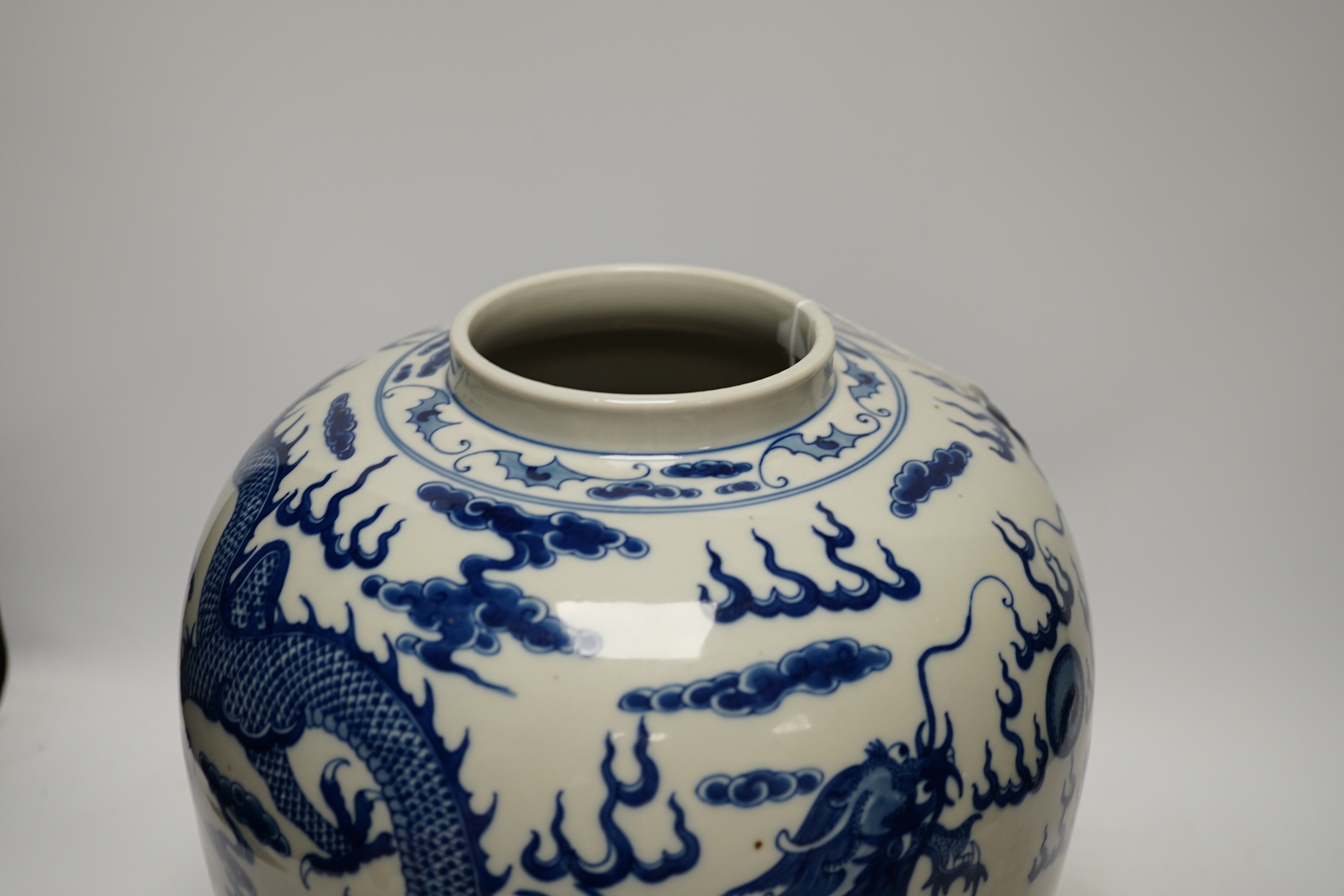 A large Chinese blue and white ‘dragon’ ginger jar and cover, 32cm